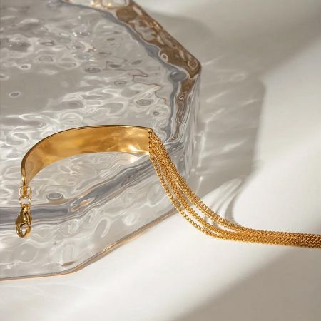 Gold Stainless Steel Chain Bracelets for Women Dainty Layered Cuban Link Gift Set of 5 - A stylish set of five gold stainless steel chain bracelets for women, featuring layered and Cuban link designs, displayed on a clean background.