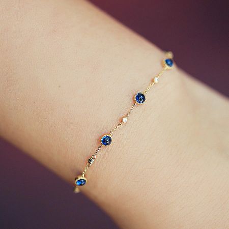 Wholesale 925 Sterling Silver Gold Plated Blue Zircon Chain Bracelets (Set of 5) - A stunning gold-plated 925 sterling silver bracelet from a wholesale set, featuring sparkling blue zircon and clear accent stones on a white background.