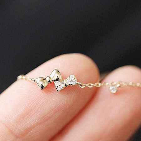 Close-up of the bracelet's clasp and delicate chain construction.