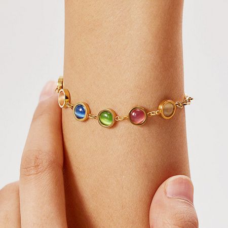Elegant gold bracelet showcasing a variety of beautifully colored gemstones.