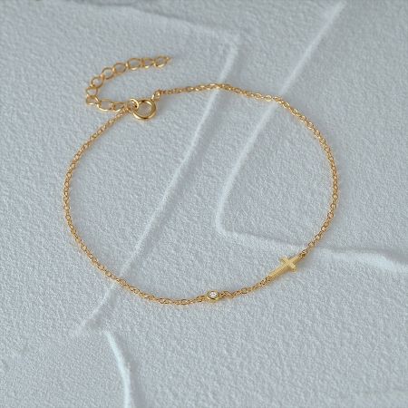 925 Sterling Silver Gold Cross Bracelet with Cubic Zirconia for Women Set of 5 - A delicate 925 sterling silver gold-tone bracelet featuring a sideways cross charm and a sparkling cubic zirconia stone on a white background.