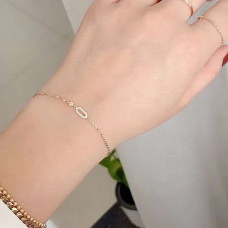 Minimalist cubic zirconia baguette bracelet styled with a casual outfit.