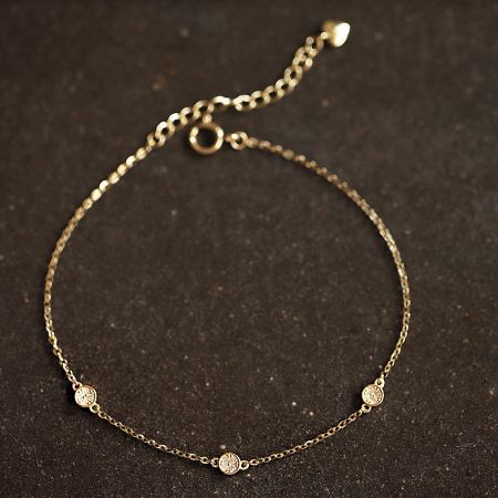 Detailed view of the sparkling zircon accents on the sterling silver bracelet.