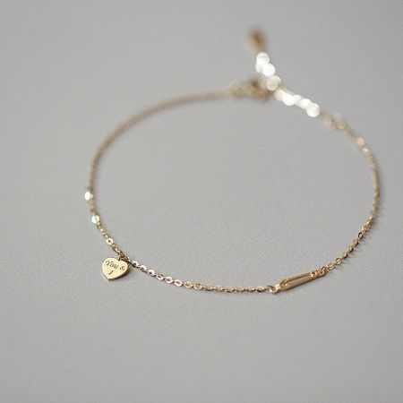 925 Sterling Silver 'You & I' Heart Charm Bracelet Set - Close-up of the 925 Sterling Silver 'You & I' heart charm bracelet, showcasing the detailed engraving on the gold-plated heart charm.