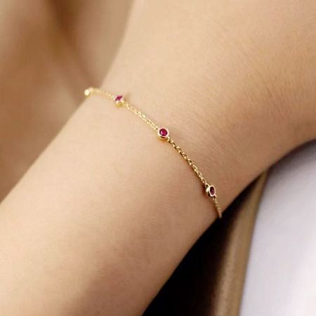 Full view of the sterling silver ruby and cubic zirconia bracelet, highlighting its elegant design.