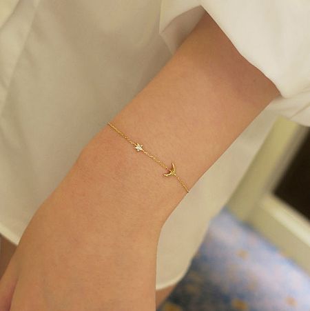 Close-up of the intricate star and crescent moon charms.