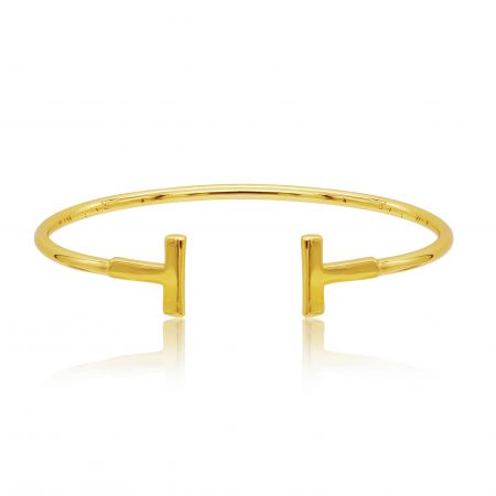 Modern Polished Bar Bangle - A close-up of the Modern Polished Bar Bangle in gold, showcasing its sleek design and distinctive T-shaped ends.