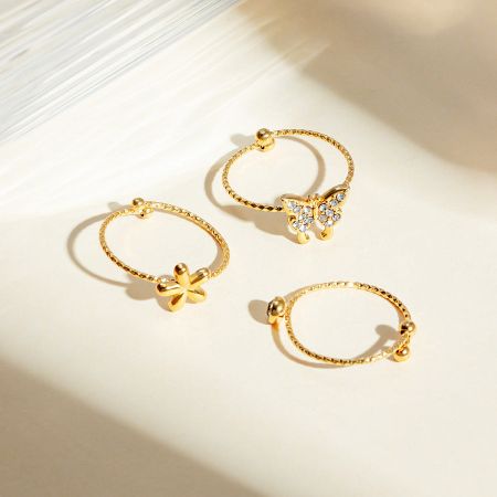 Another angle of the stylish and whimsical flower and butterfly themed rings.