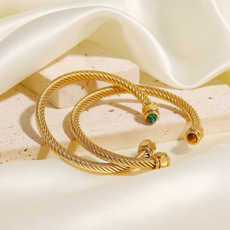 Close-up view of the stainless steel twist pave open cuff bangles, highlighting the natural stone details.
