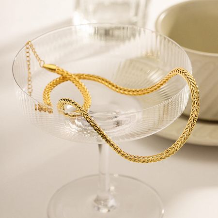 Full view of the chunky gold twisted rope necklace, showcasing its texture.