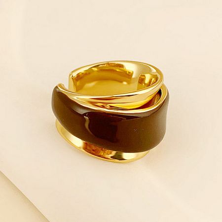 Detailed product shot of the dual-layered chocolate enamel brass ring.
