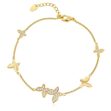 Delicate gold charm bracelet featuring a gemstone-encrusted butterfly.