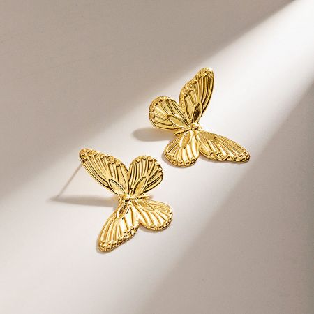 Front view of the stylish gold butterfly earrings.