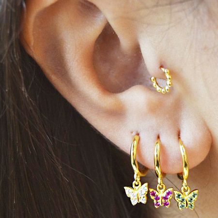 Model showcasing the elegant 925 sterling silver butterfly zircon drop earring.