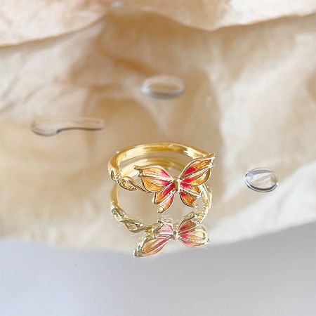 Full set of five gold-plated butterfly rings shown together.