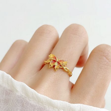 Detailed product image of the adjustable butterfly ring on a white background.