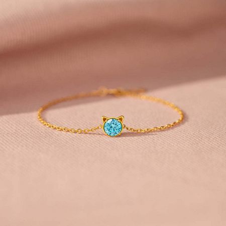 925 Sterling Silver Cat Bracelet with Blue Cubic Zirconia, Set of 5 - A delicate 925 sterling silver cat bracelet in a gold tone, featuring a minimalist cat face pendant with a sparkling blue cubic zirconia stone.