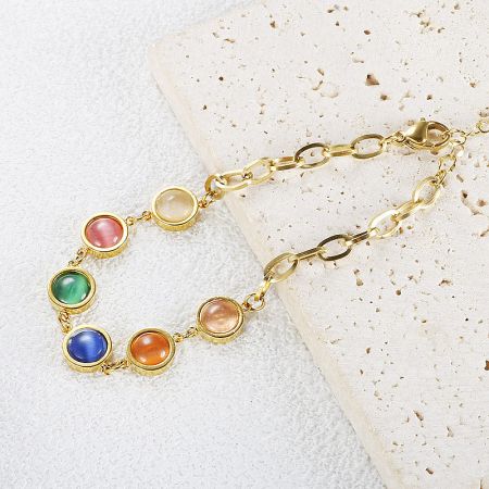 A delicate gold chain bracelet with seven colorful stones, perfect for layering.