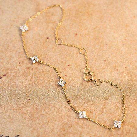 Another bracelet from the set showcasing the intricate diamond flower design.