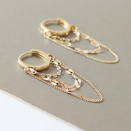 Product shot of the sterling silver multilayer chain earrings.