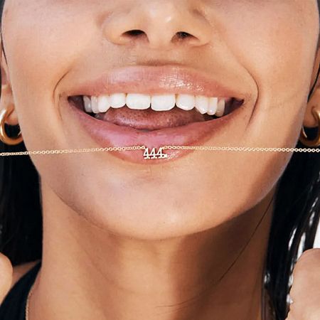 Model wearing the 925 sterling silver angel number 444 necklace.