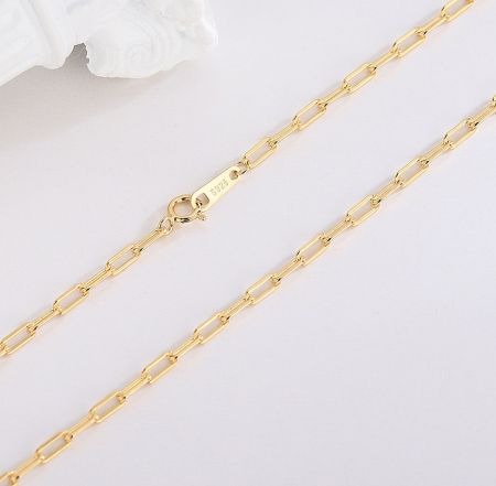 Detailed view of the S925 sterling silver stamp on the lobster clasp of the paper clip chain necklace.