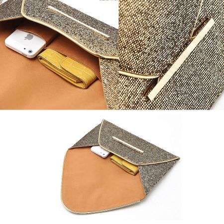 Interior view of the gold clutch bag, revealing a tan lining and ample space.