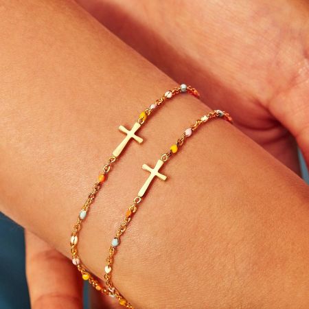 Two gold-plated 925 sterling silver cross bracelets with colorful beads.