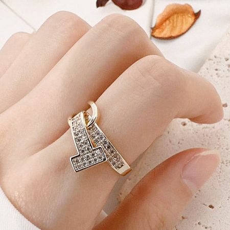 Fashion Gold Plated Opening Zircon Stone Finger Rings Set of 5 - Close-up of a gold-plated fashion ring from the five-piece set, featuring a sparkling zircon-studded cross design, worn on a finger.