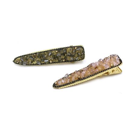 Both color options for the gold crystal hair clips displayed together.