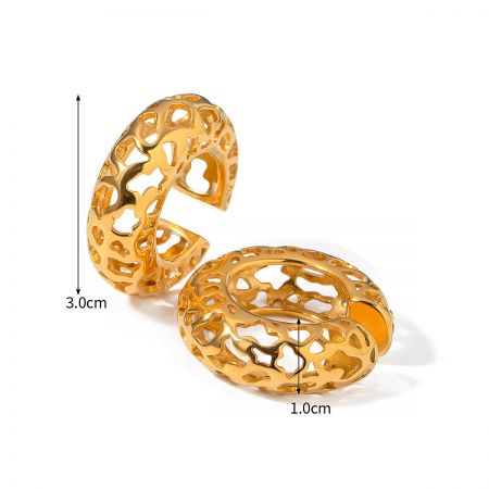 Two cylindrical gold-plated ear cuffs with intricate cutout patterns.