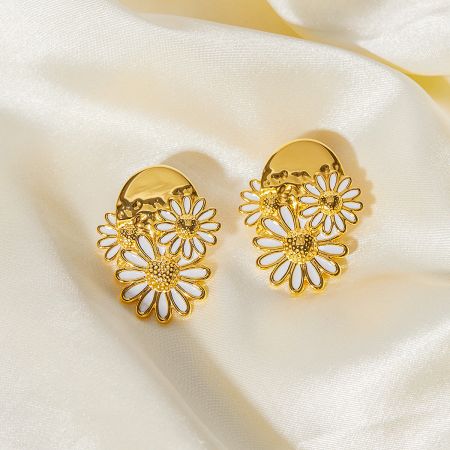 Three gold daisy clip-on style earrings shown together.