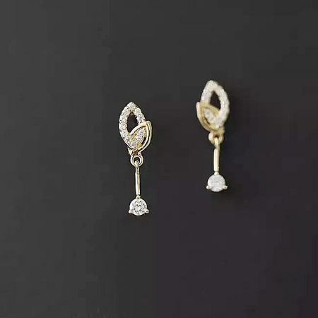 Detailed view of the delicate leaf design on the 14K gold plated sterling silver earrings.