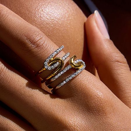 Two Tone Gold and Silver Rhinestone Rings Set of 5 - A close-up of the two-tone gold and silver rhinestone ring set, highlighting the sparkling stones and mixed-metal design.