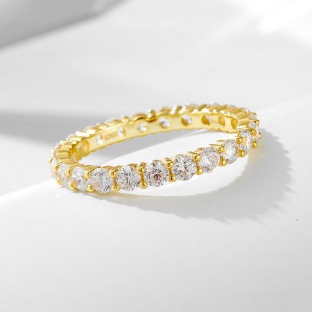 The complete 3-piece bridal ring set, including the oval cut CZ engagement ring and two matching eternity bands in gold-plated silver.