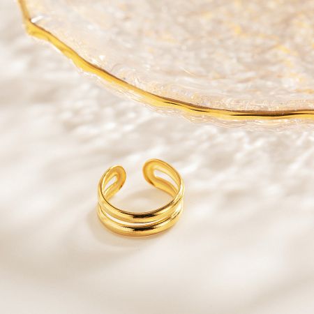 Detailed shot of the double-layered gold cuff's structure.