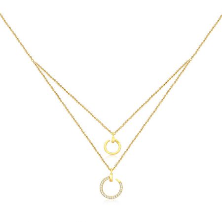 Wholesale Layered Necklace Circle Pendant in Gold - Wholesale layered necklace with two gold chains and circular pendants, one plain and one with cubic zirconia stones, on a white background.