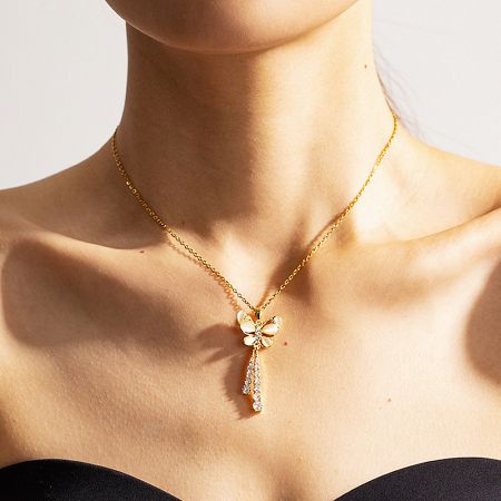 Close-up of a gold dragonfly pendant necklace with crystal accents, part of the stainless steel necklace collection.