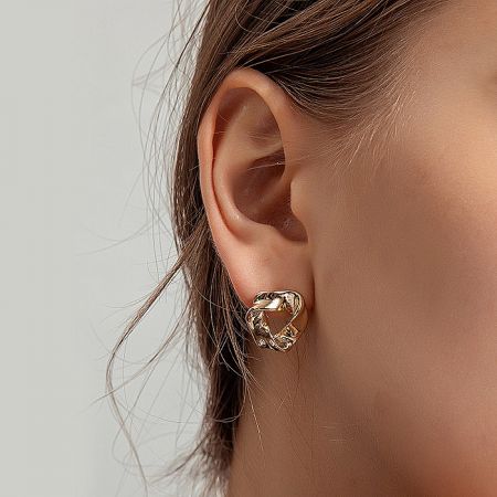 Detailed close-up view of the Gold Triangle Post Earring highlighting its polished gold finish.