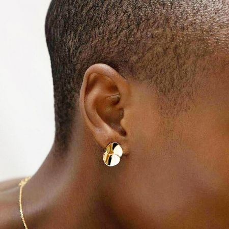 On-model image of the gold double disc earring, showing how it complements the wearer.