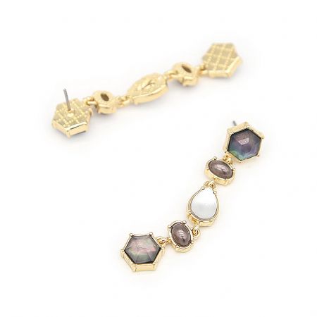 Close-up detail of the vintage statement earring showcasing the iridescent gemstones and gold plating.