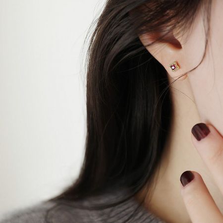 Alternative color option featuring a delicate pink gemstone in the same vintage gold setting.