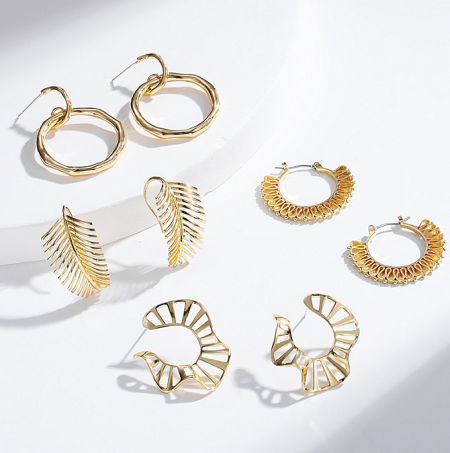 18K Gold Plated Earrings Collection - A diverse collection of 18K gold-plated earrings by JR Fashion Accessories, showcasing various elegant designs for wholesale.