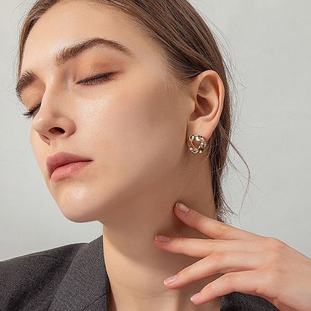 Model showcasing the stylish Gold Triangle Post Earrings, perfect for daily wear.