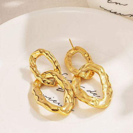 A pair of stainless steel chunky gold elliptical interlock charm drop earrings.