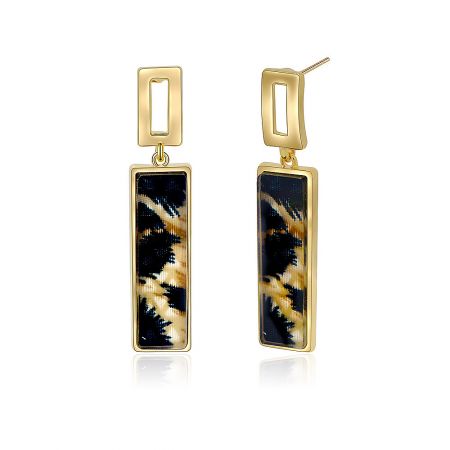Close-up shot of the gold-plated stud earring showcasing the intricate leopard pattern on the poly resin insert.