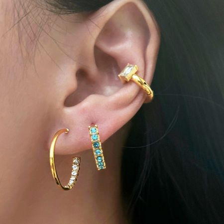 Styling inspiration showing the zirconia hoop earrings paired with other fashion accessories.