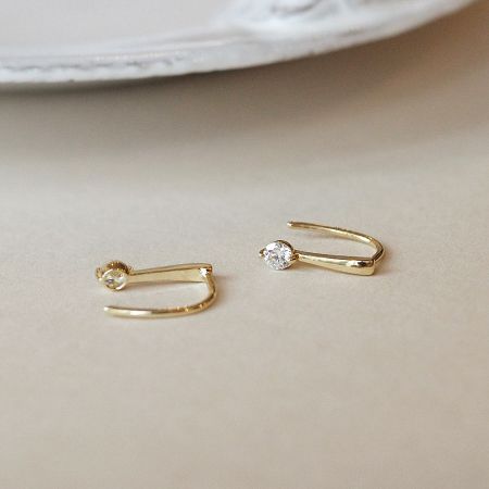 Clean product shot of the 925 silver gold zircon earrings on a white background.