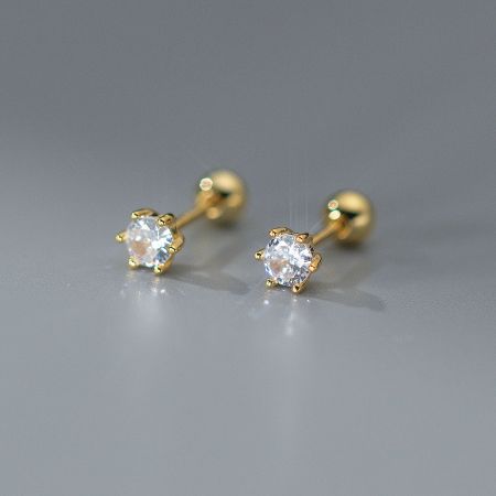 Close-up view of the gold-finished 925 silver stud earrings with a secure six-prong setting.