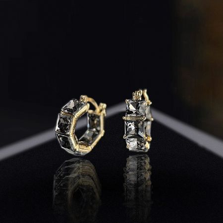 Two styles of gold-plated crystal earrings, one with gray and one with clear stones.